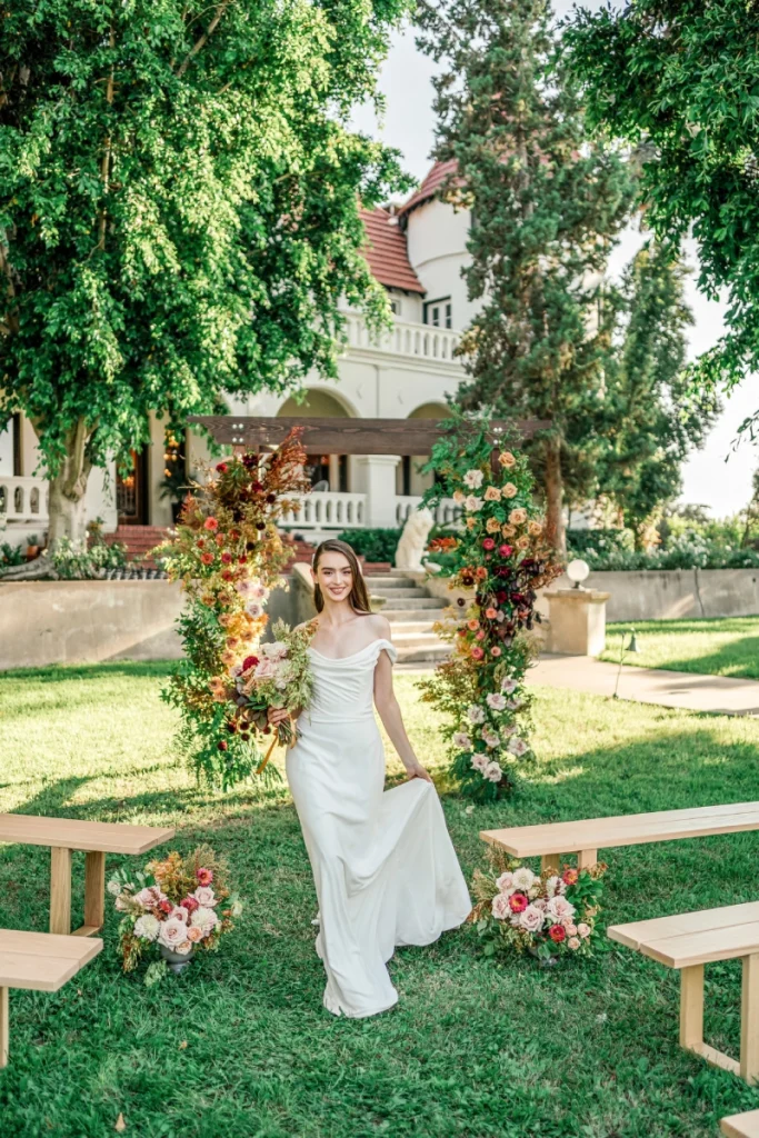 Wedding setup — Timber Chuppah Arch, Santa Monica Bench | Vogue Rentals