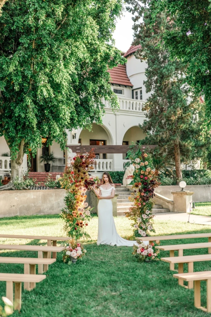 Wedding setup — Timber Chuppah Arch, Santa Monica Bench | Vogue Rentals