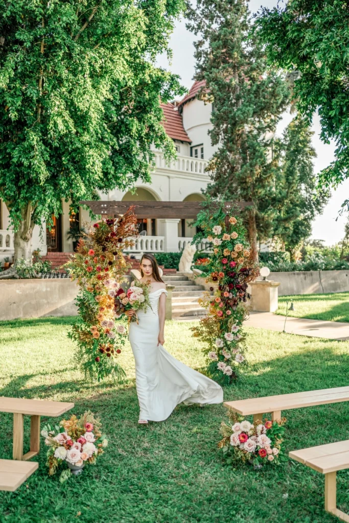 Wedding setup — Timber Chuppah Arch, Santa Monica Bench | Vogue Rentals